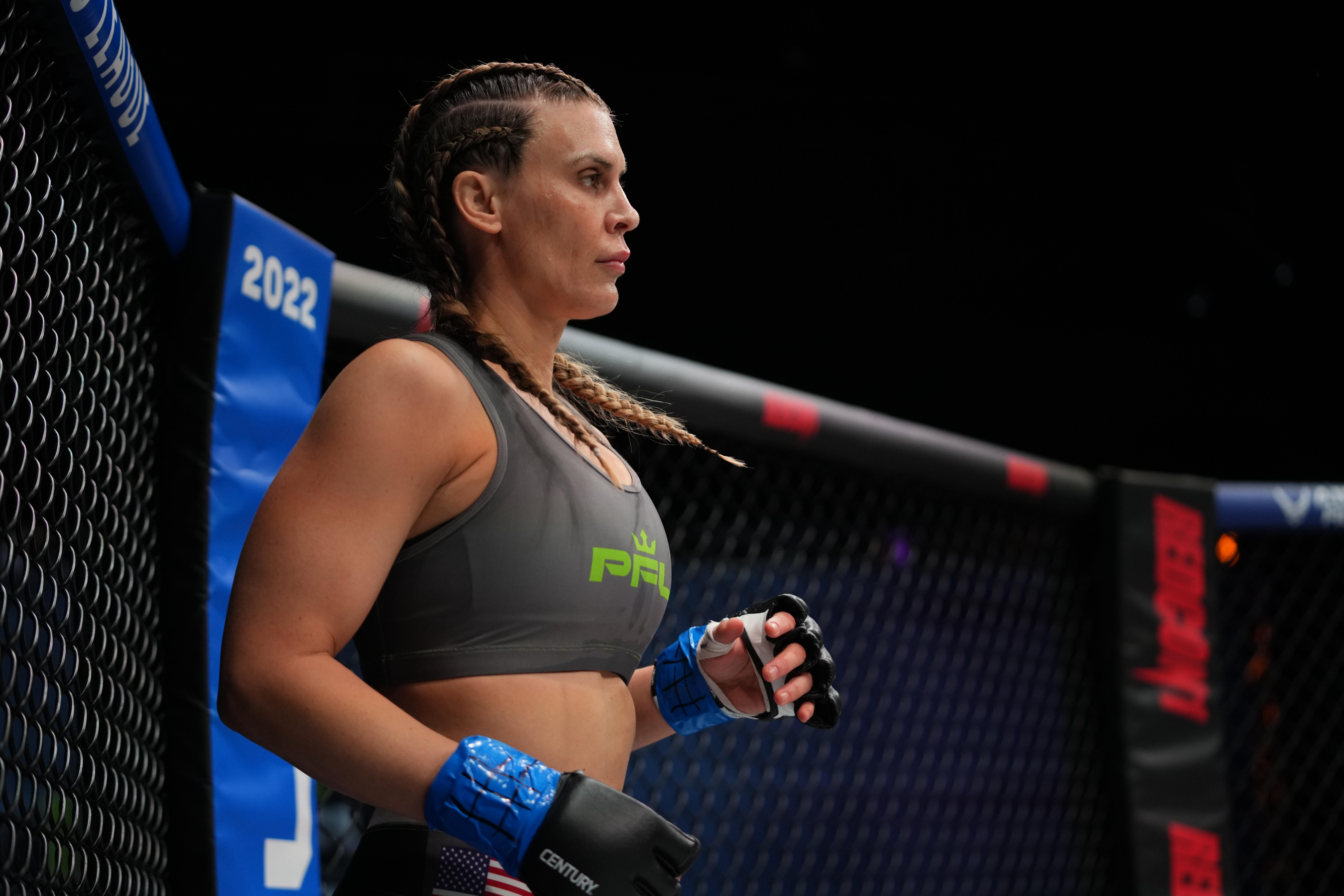 Camee Adams standing in the cage as a professional MMA fighter
